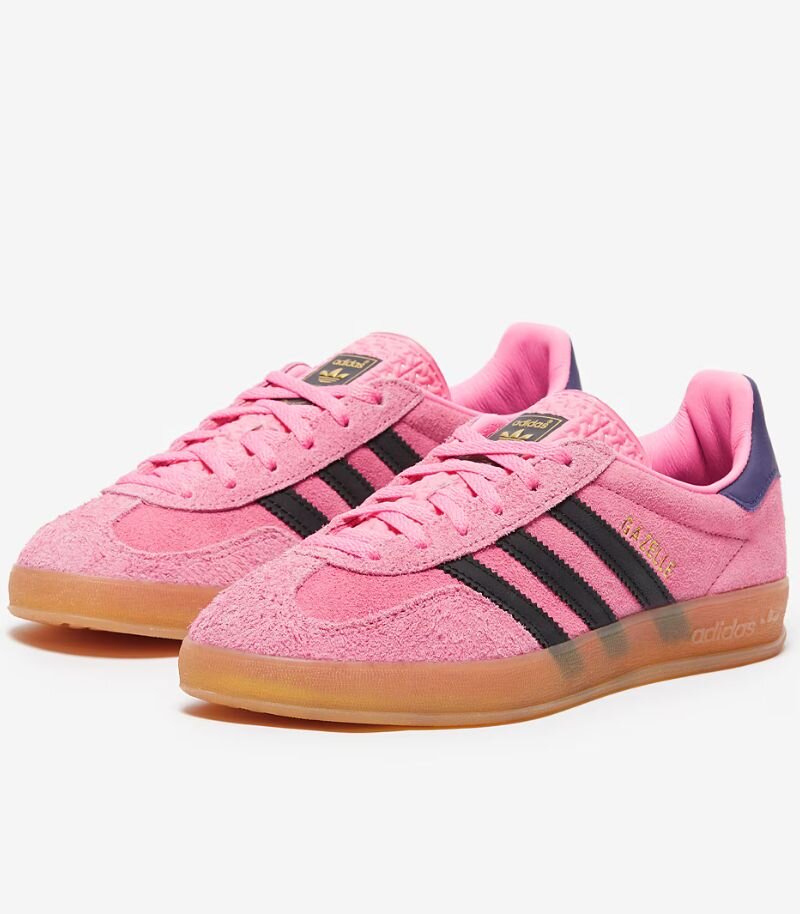 pink adidas gazelles with dark blue stripes and details 